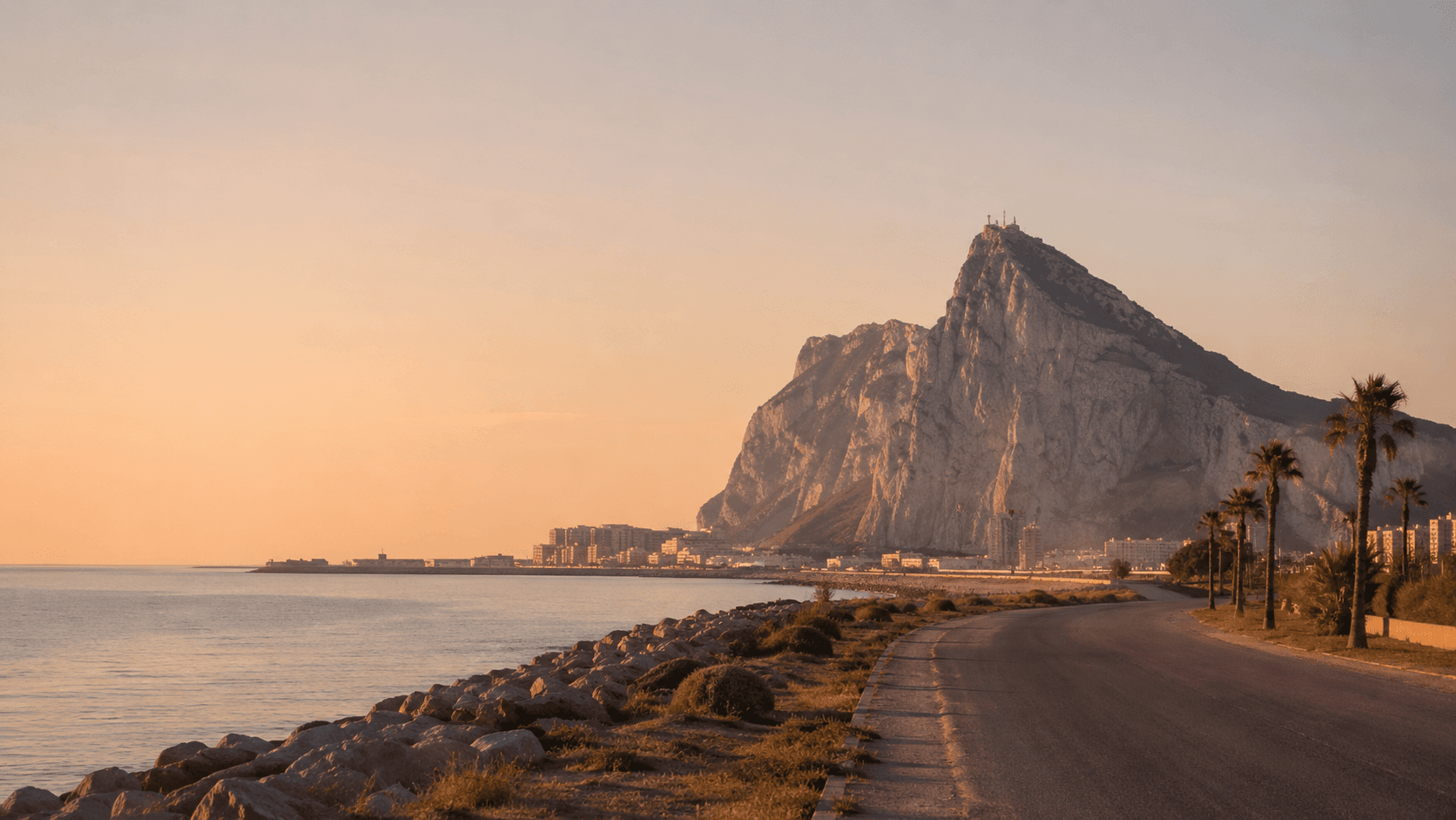 The Rock of Gibraltar at golden hour from the Spanish side - the land border between Spain and Gibraltar comes down on 15 July 2026 under the new UK-EU treaty.